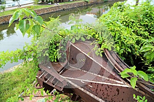 Old military bunker with tank cannon in Dong Hoi citadel wall, Quang Binh, Viet Nam